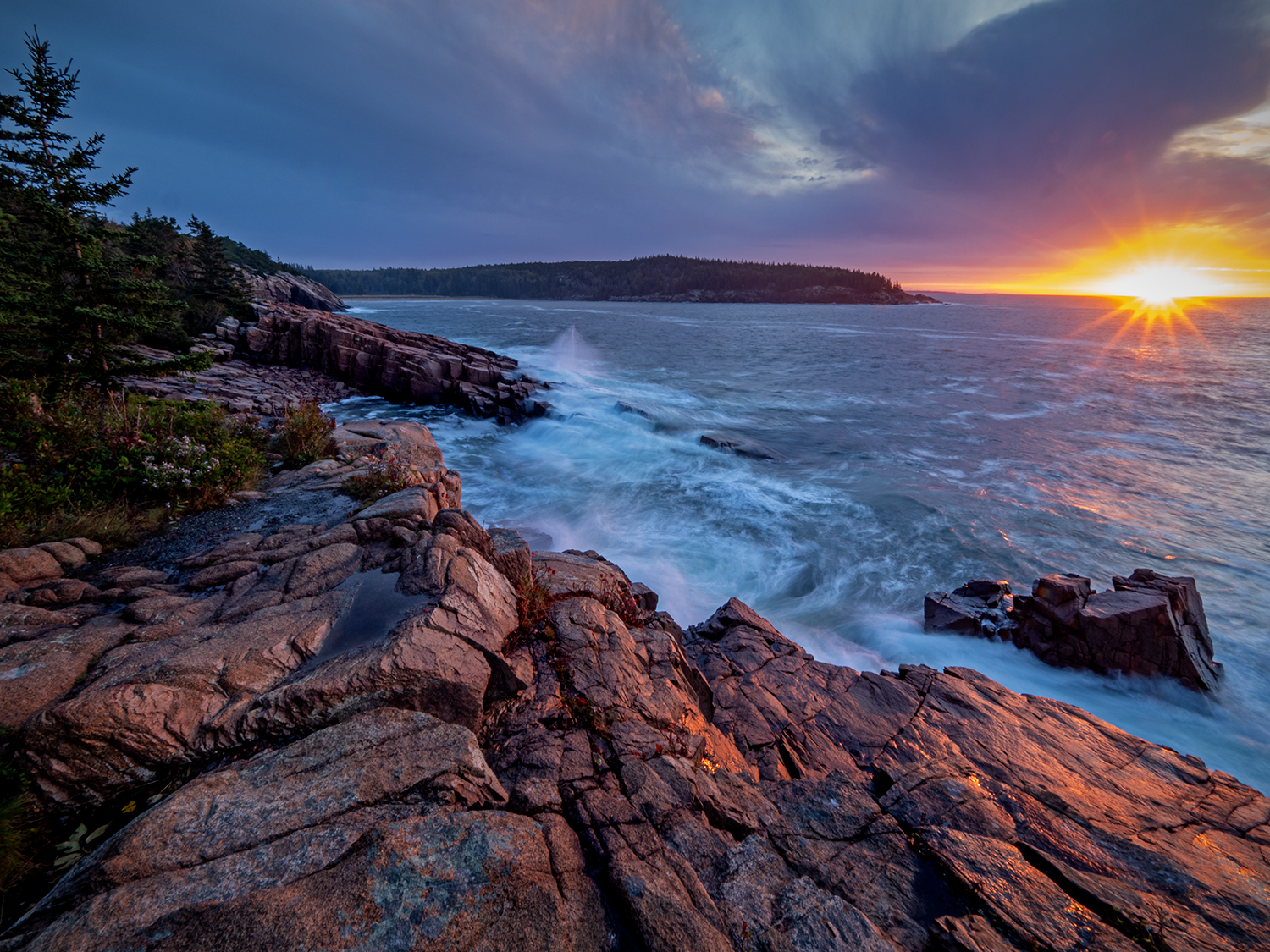 Waves crashing against granite ledges along Ocean Drive in Acadia National Park, Maine