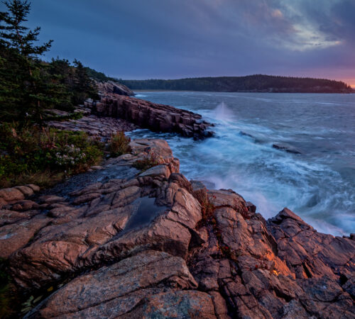 Waves crashing against granite ledges along Ocean Drive in Acadia National Park, Maine