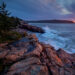 Waves crashing against granite ledges along Ocean Drive in Acadia National Park, Maine