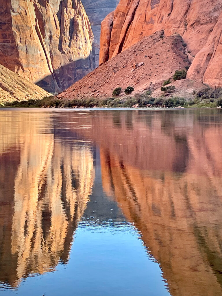 Cliffs reflect into the Colorado River in Glen Canyon, Glen Canyon National Recreation Area, AZ